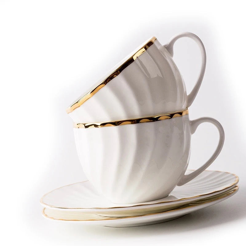 WHITE TEA CUP AND SAUCER WITH GOLD DETAIL