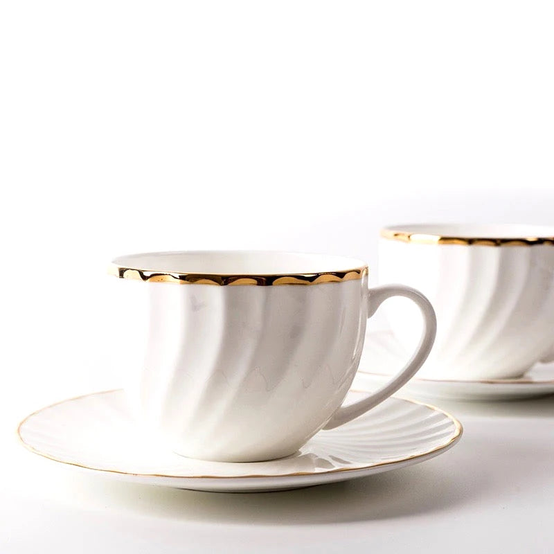 WHITE TEA CUP AND SAUCER WITH GOLD DETAIL