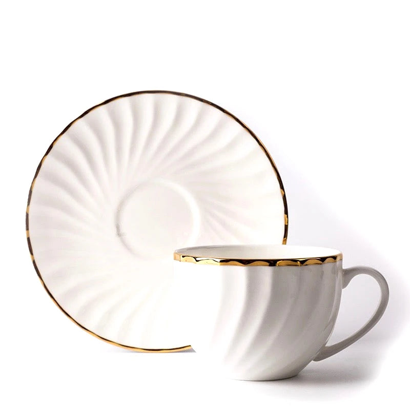 WHITE TEA CUP AND SAUCER WITH GOLD DETAIL