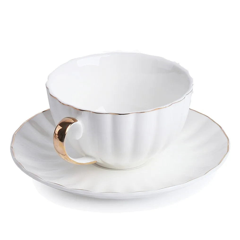 WHITE TEA CUP AND SAUCER WITH GOLD DETAIL